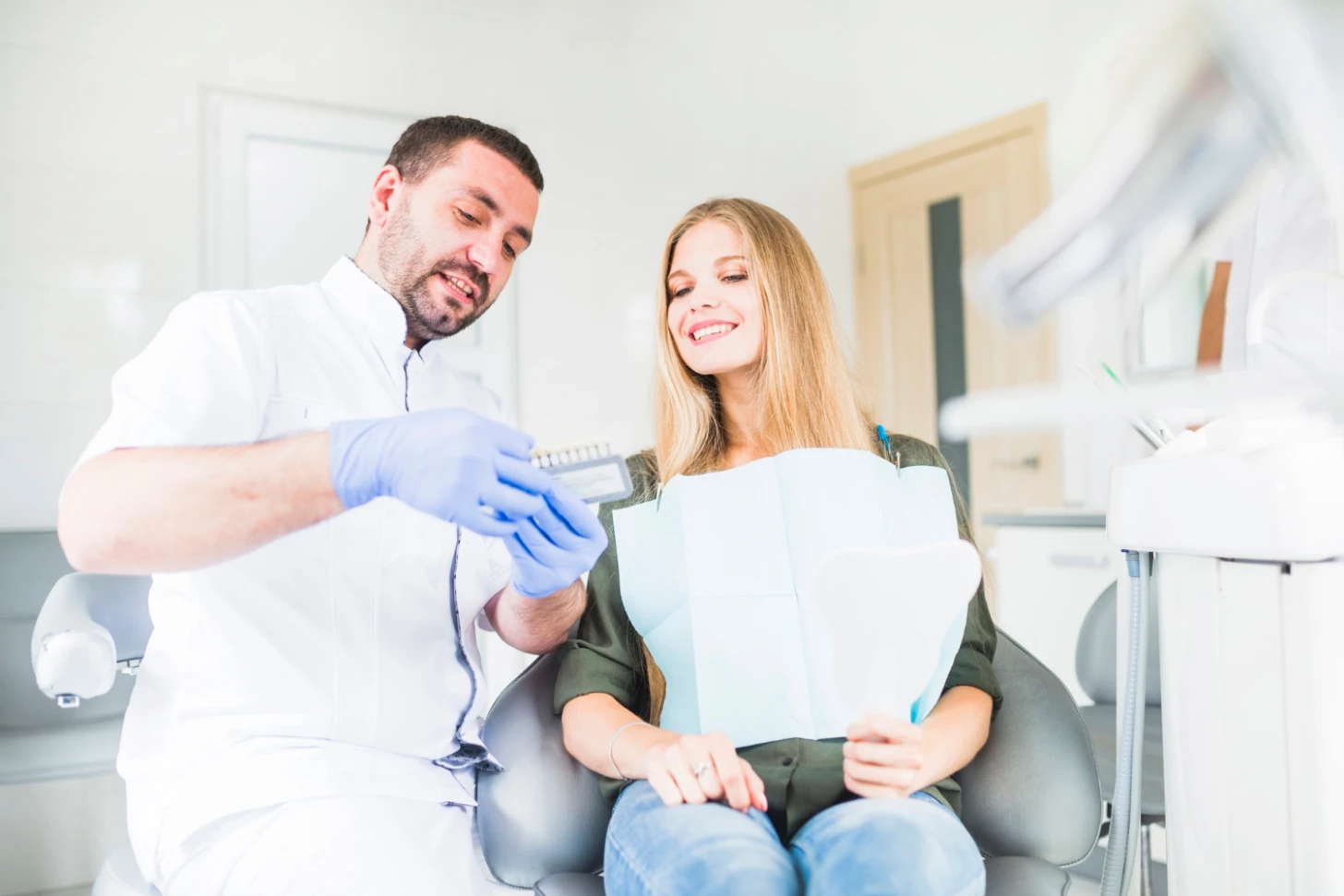 Dentist explaining procedure to patient.